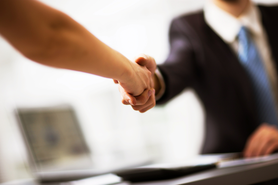 Two businesspeople shake hands.