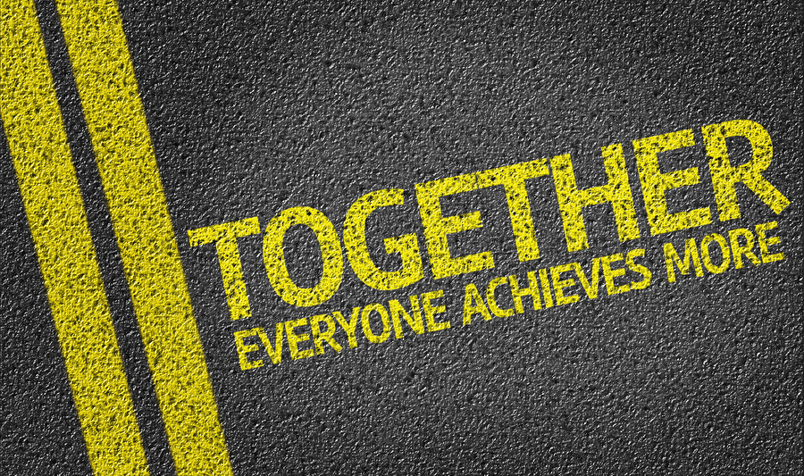 Together Everyone Achieves More written on the road Effective Business Communication Through Smashing Silos